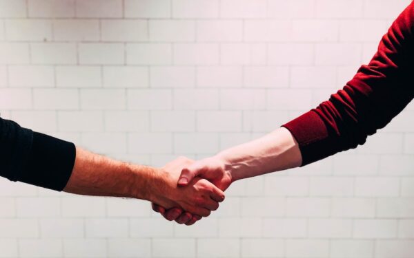 Two contractors shaking hands after a job interview