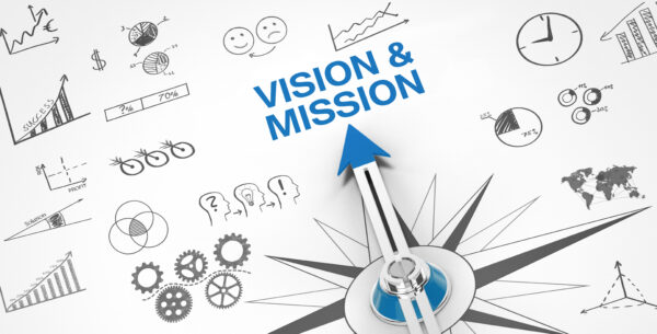 A compass pointing at vision & mission