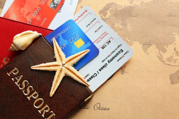 Business credit card with travel miles in passport on a map