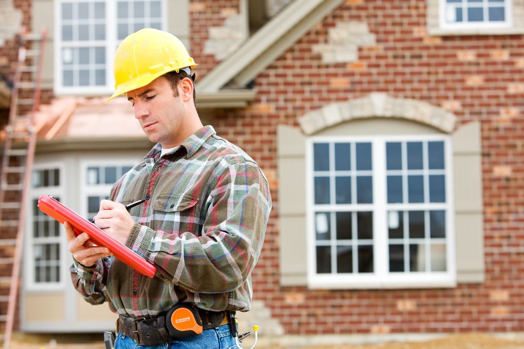 Roofing contractor at a home with a roof contract