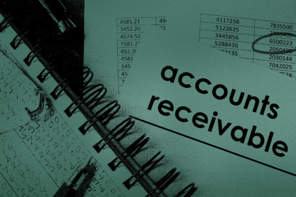 accounts receivable papers and pen